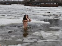 Russian traditional swimming in a winter ice hole