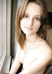 Busty amateur girl posing naked at home