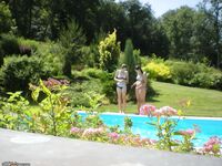 Three amateur girl near pool
