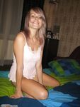 Amateur blonde posing on bed