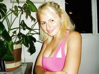 Busty blond posing and sucking