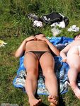 Two amateur GFs sunbathing topless