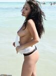 Sexy brunette topless at beach
