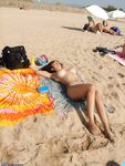 Busty arab MILF at nude beach
