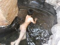 Asian MILF bathes in a thermal spring