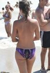 Busty nudist babe topless at beach