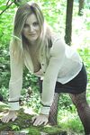 Blonde Melanie posing nude in the woods