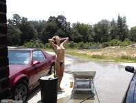 Naked girl at car washing