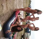 Four cute amateur girls topless outdoors