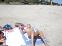 Two amateur GFs sunbathing topless 3