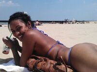 Ebony amateur girl sunbathing topless