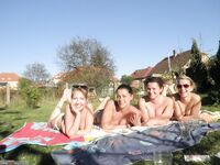 Four amateur girls topless outdoors 2