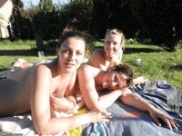 Four amateur girls topless outdoors 2