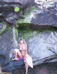 My sexy wife posing nude on rocks