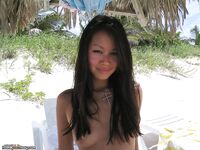 Tanned Asian honey on the beach