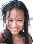 Tanned Asian honey on the beach
