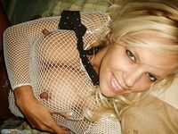 Blonde sex bomb in fishnets