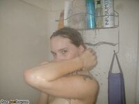 Tattooed babe taking a bath