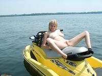 Naked blonde on ski boat