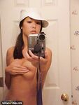 Tall Slim Beautiful Asian Girl In A Hat Poses Nude