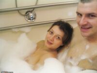 Amateur couple taking bath and fucking