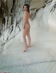Beautiful young girls naked posing on beach