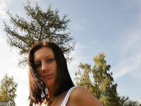 Girl posing topless outdoors