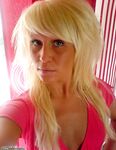 Tanned german blonde with piercied nipples