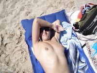 Heather sunbathing topless